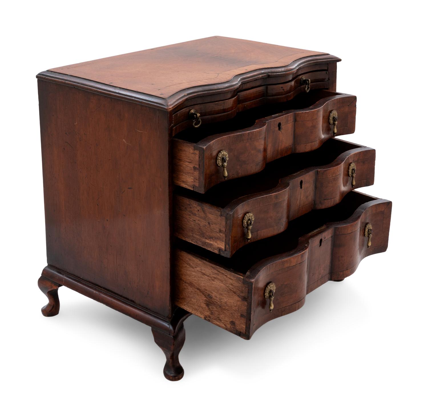 A Continental Walnut Diminutive Chest of Drawers or Salesman's Model