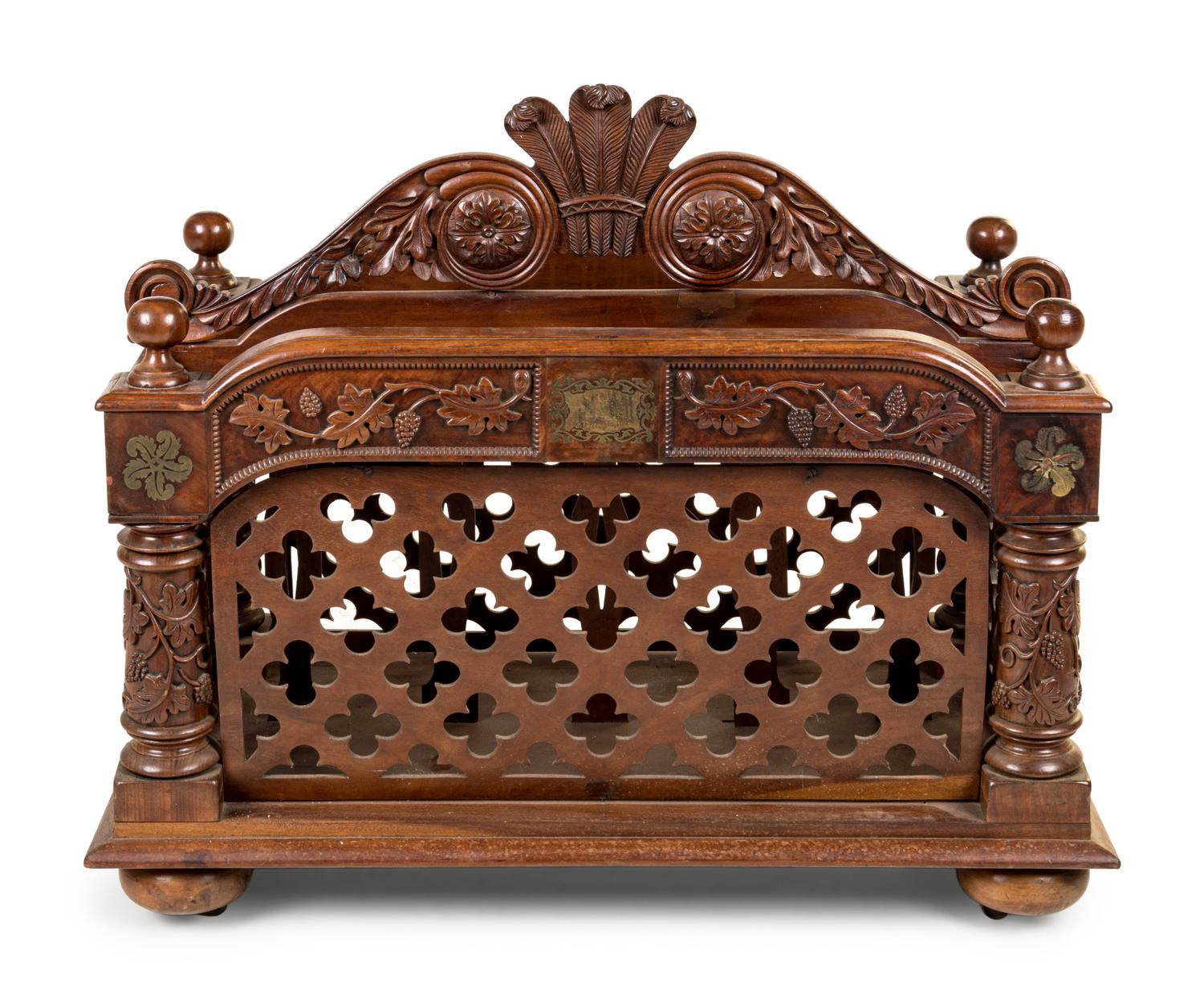 An Oversized Carved Walnut Canterbury