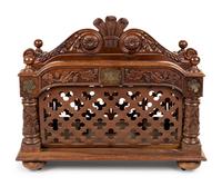 An Oversized Carved Walnut Canterbury