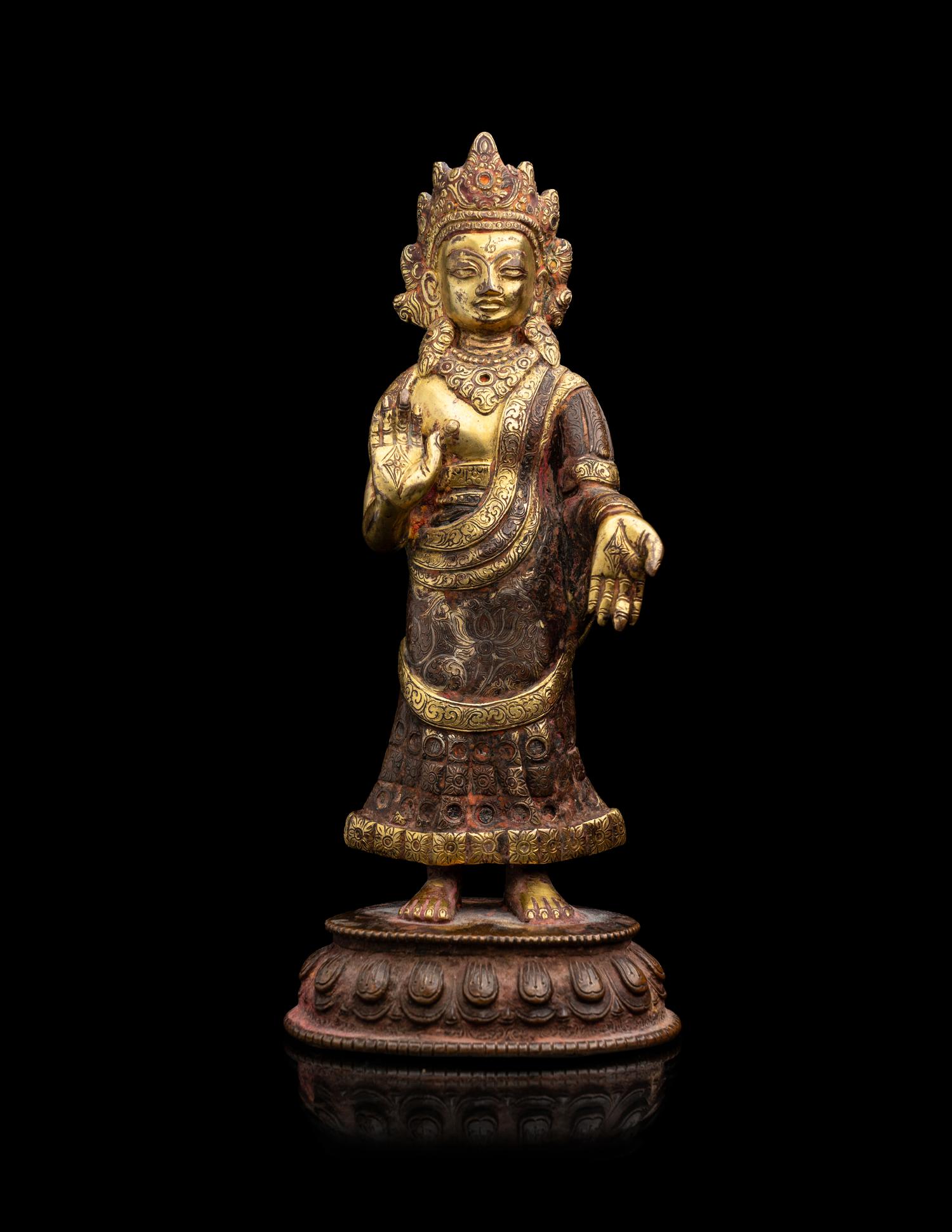 A Nepalese Gilt Bronze Standing Figure of Dipankara