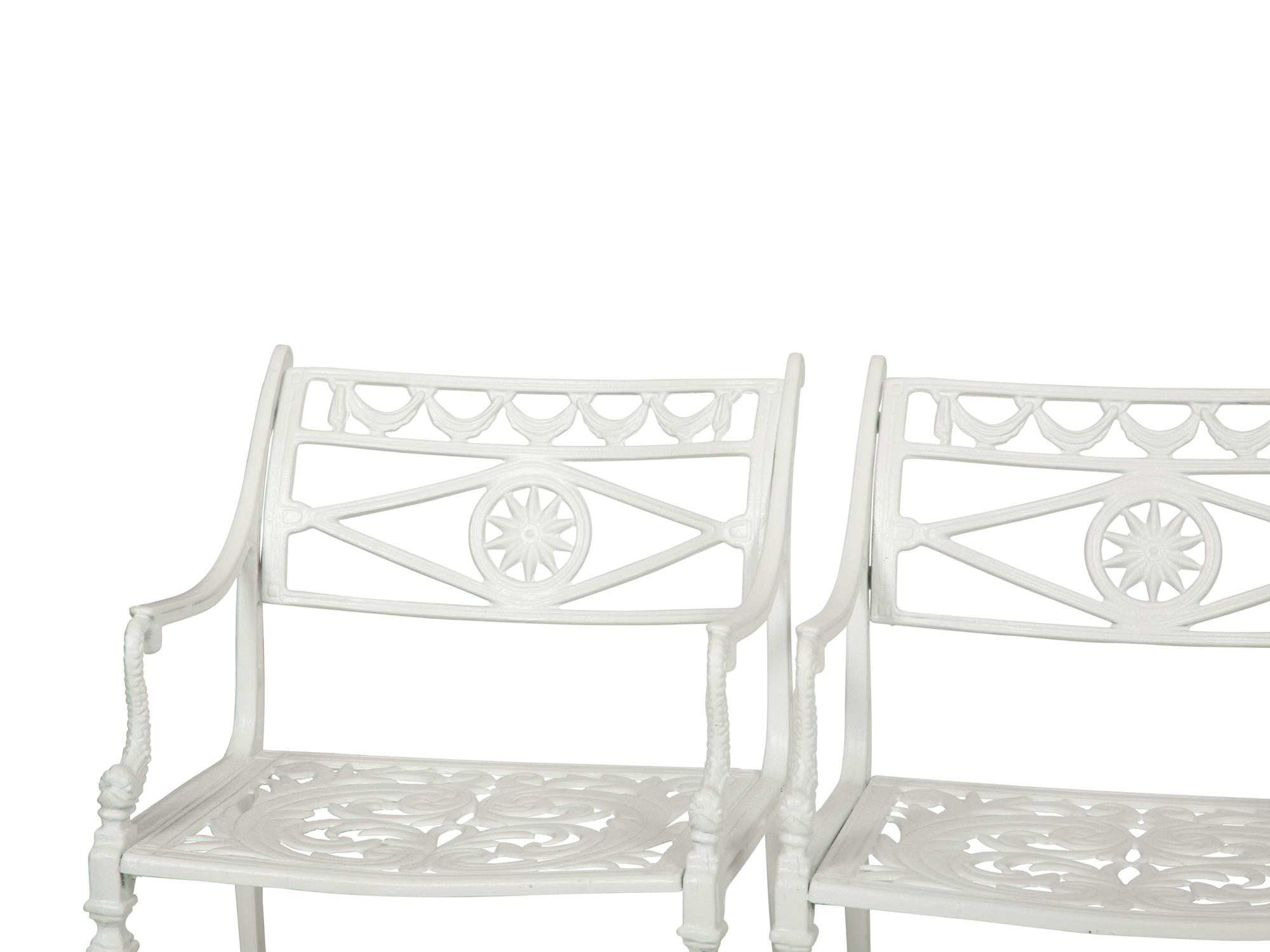 A Suite of White-Painted Cast Metal Garden Furniture