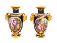 A Pair of Vienna Painted and Parcel Gilt Handled Porcelain Urns