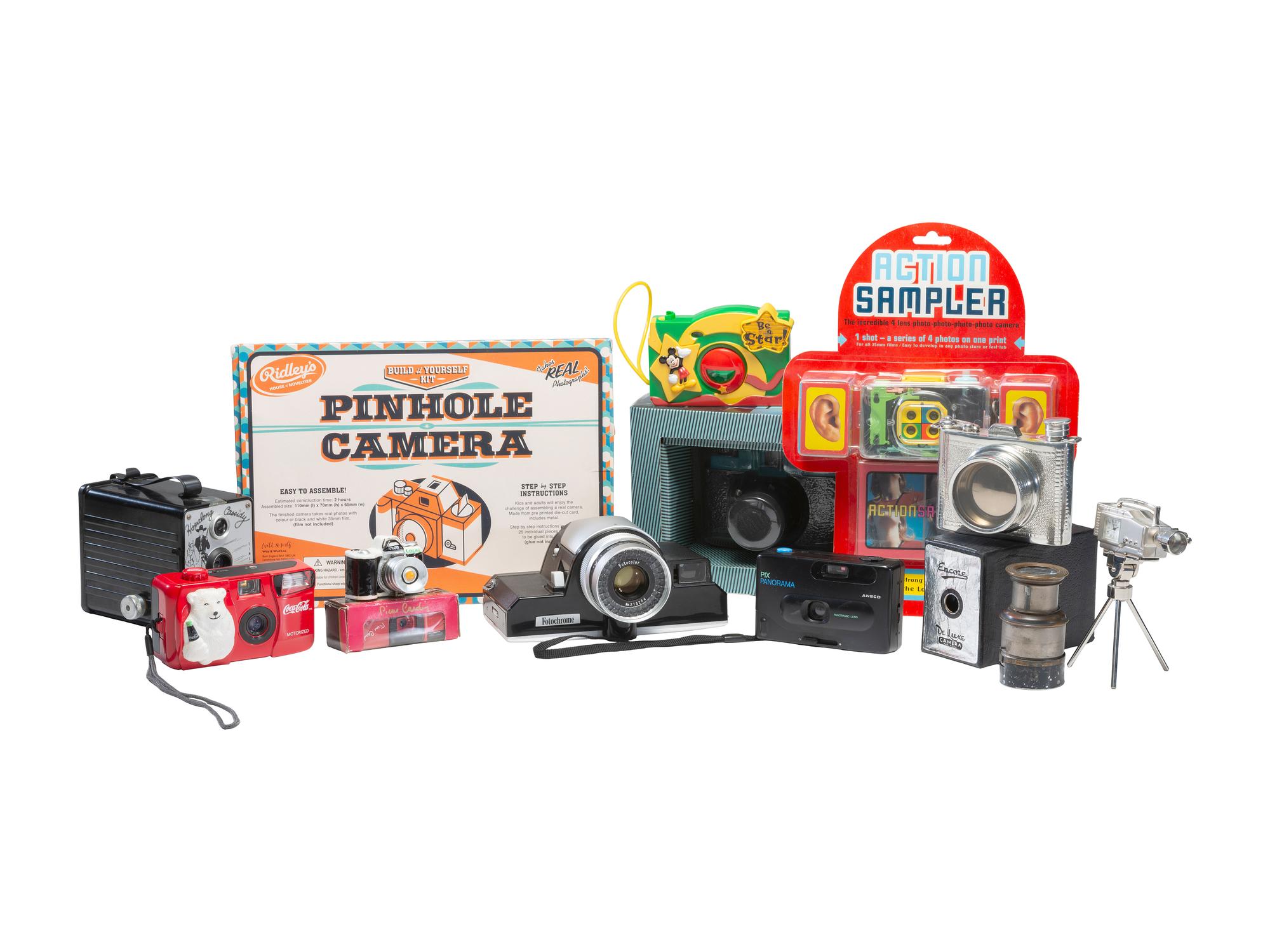 [CAMERAS]. Large group of photographic novelties and souvenirs, comprising: