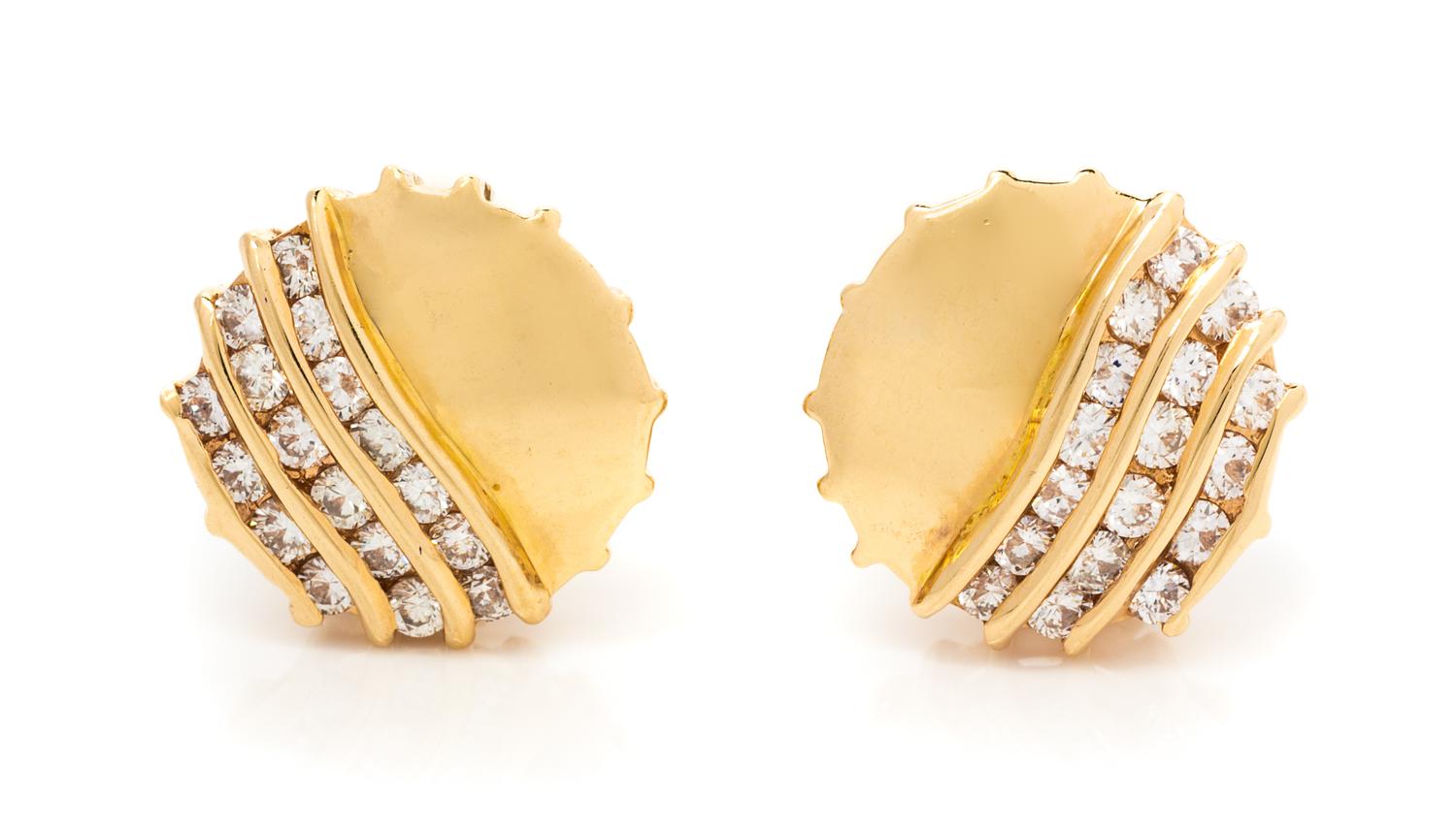 A Pair of 14 Karat Yellow Gold and Diamond Earclips, 3.90 dwts.