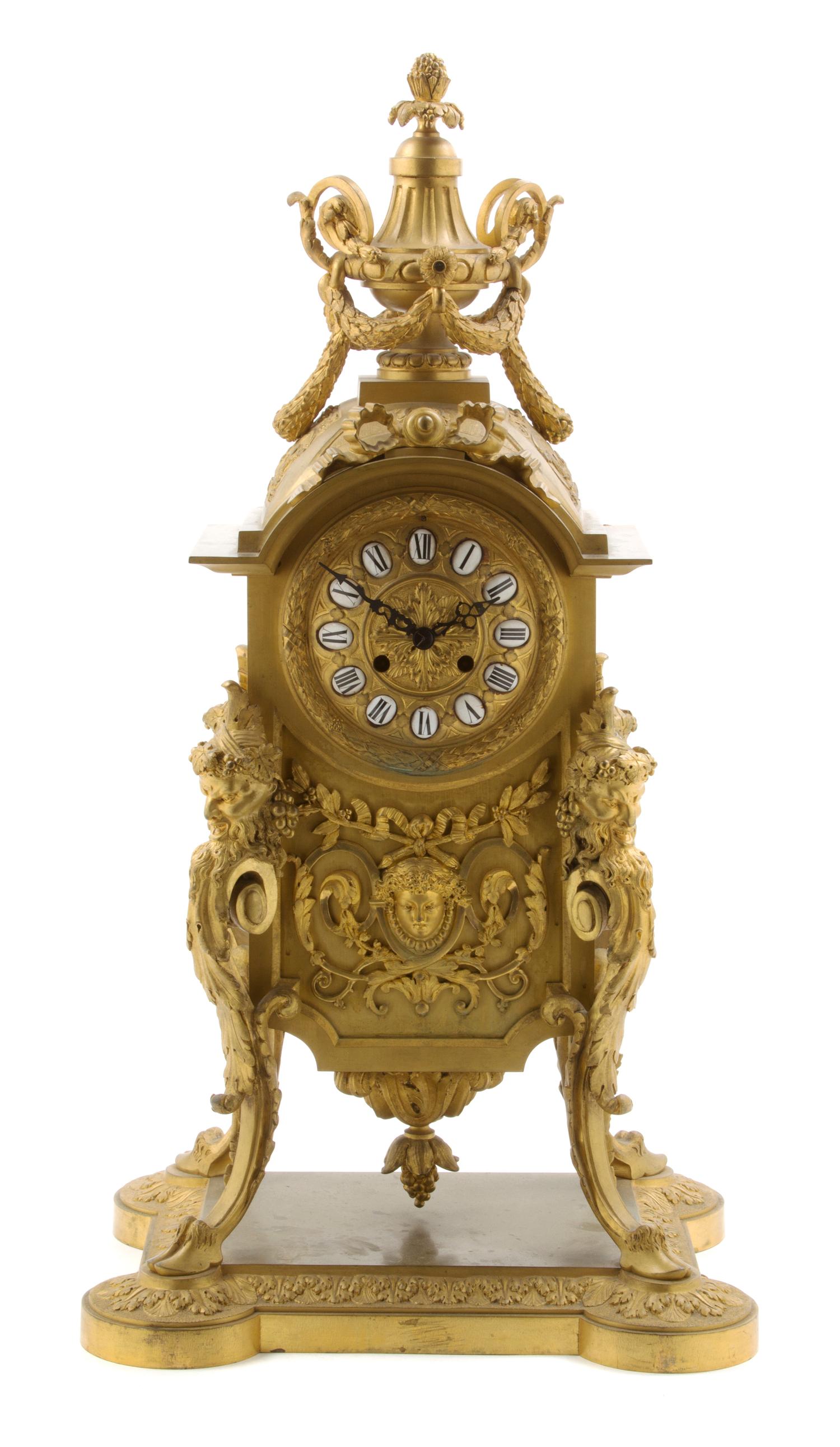 A Continental Gilt Bronze Mantel Clock, Height 27 3/4 inches.
