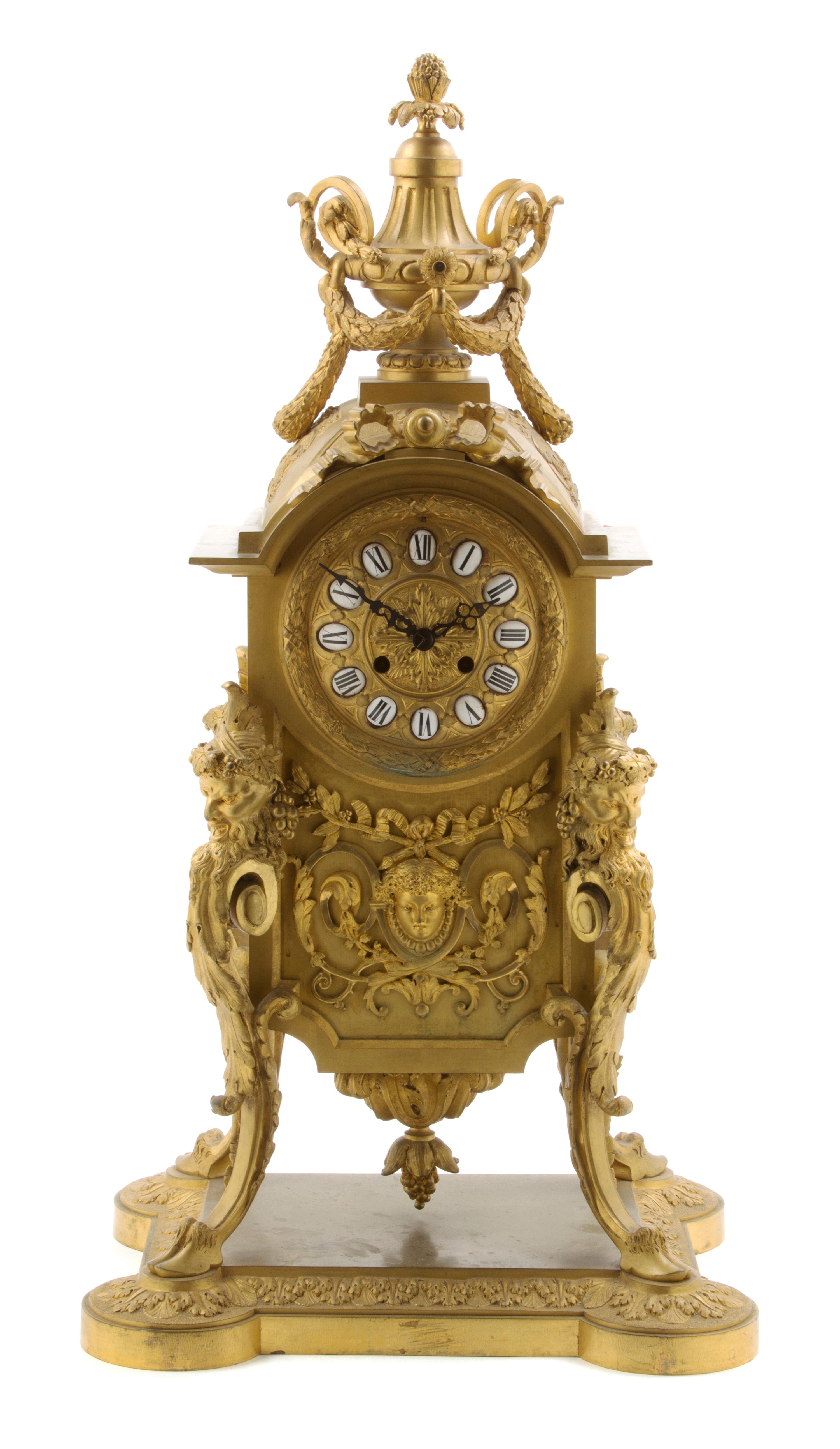 A Continental Gilt Bronze Mantel Clock, Height 27 3/4 inches.