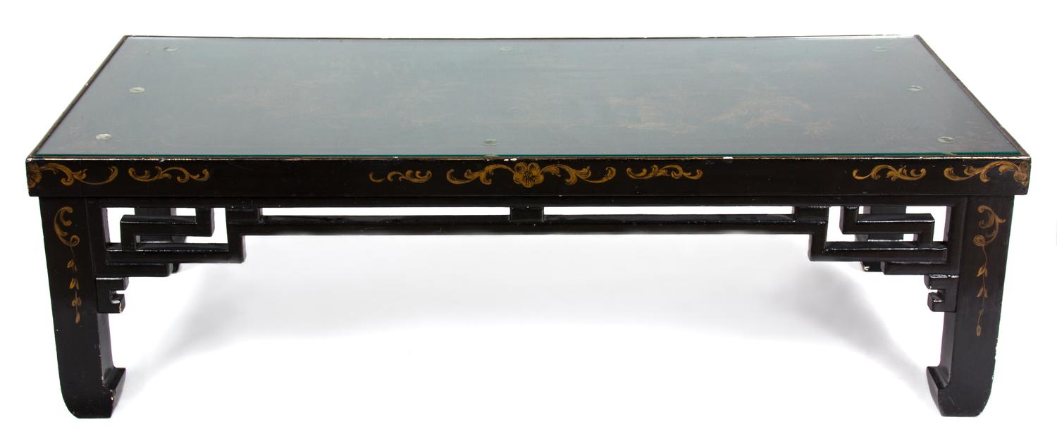 A Black and Gilt Lacquered Low Table Height 16 x width 51 1/2 x depth 24 1/2 inches. — 20TH CENTURY