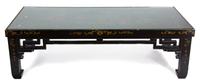 A Black and Gilt Lacquered Low Table Height 16 x width 51 1/2 x depth 24 1/2 inches. — 20TH CENTURY