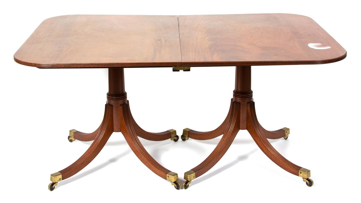 A Regency Style Two Pedestal Mahogany Dining Table Height 28 1/2 x width 59 3/4 x depth 42 1/4 inches. — EARLY 20TH CENTURY
