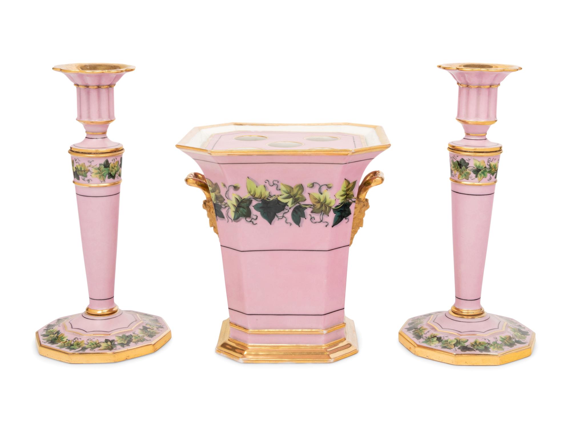 A Pair of Paris Porcelain Pink-Ground Vine-Decorated Candlesticks and a Jardinière