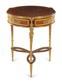 A Louis XVI Style Gilt Metal Mounted Parquetry Table