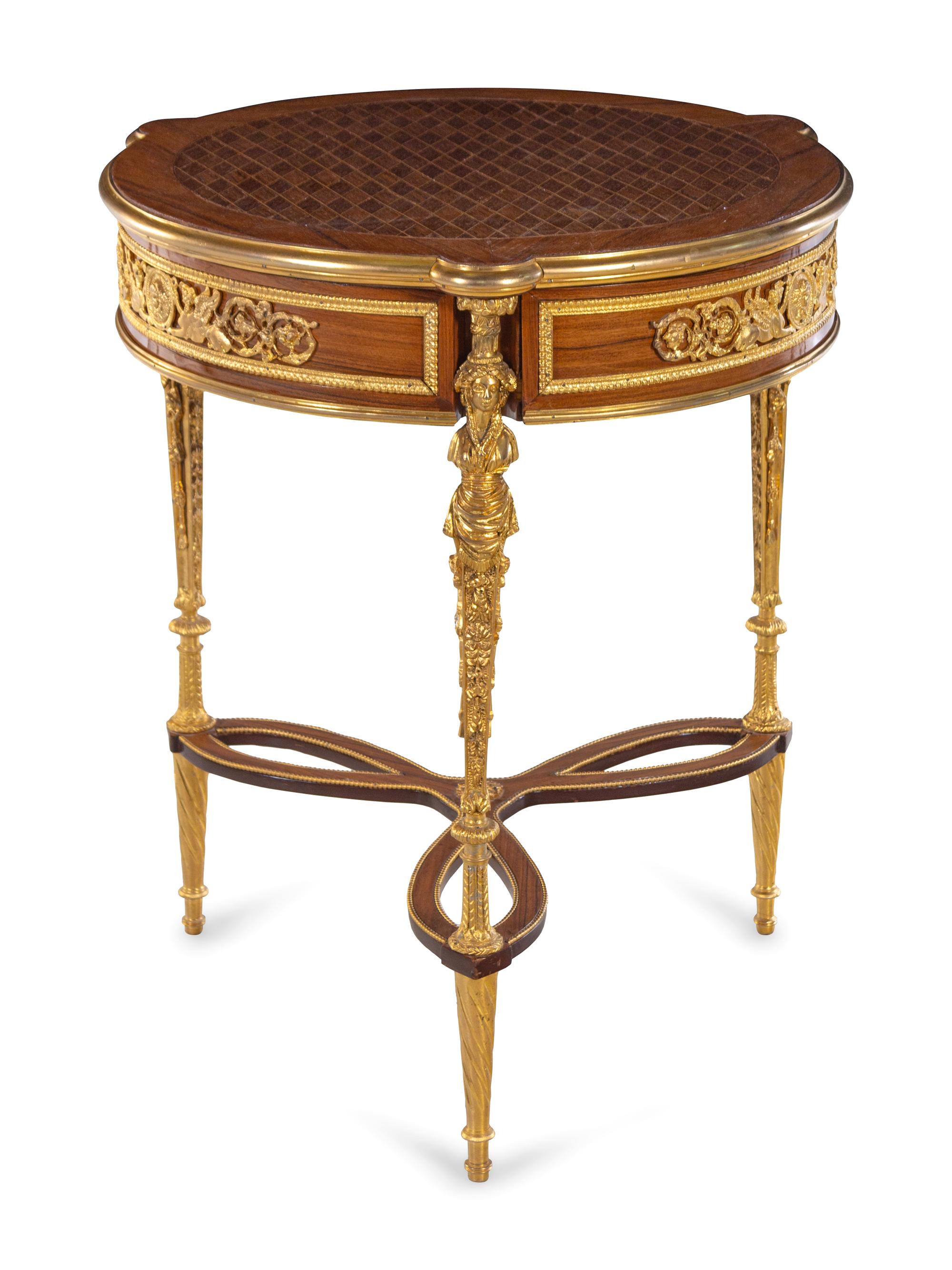 A Louis XVI Style Gilt Metal Mounted Parquetry Table