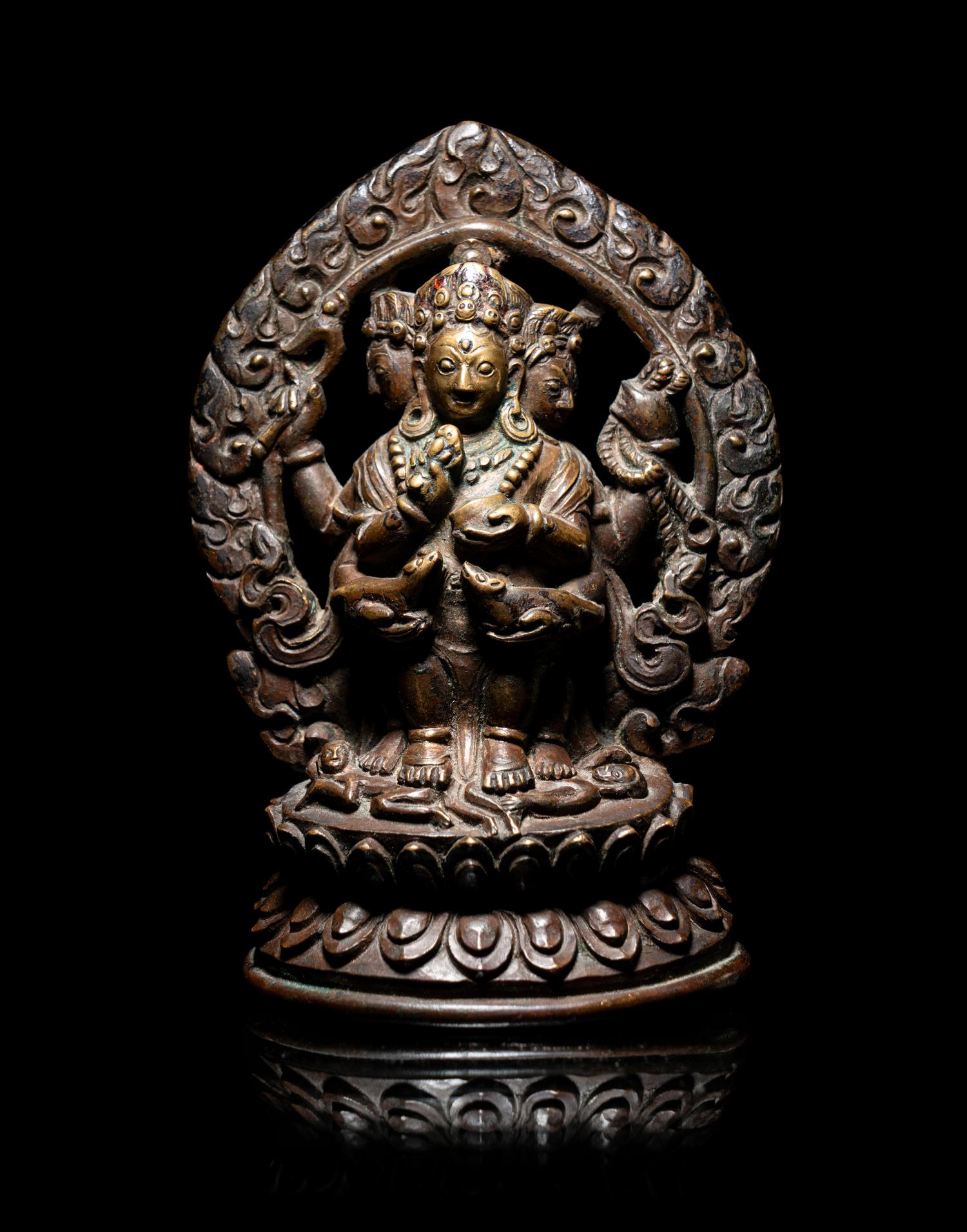 A Rare Tibetan Bronze Figure of Red Jambhala