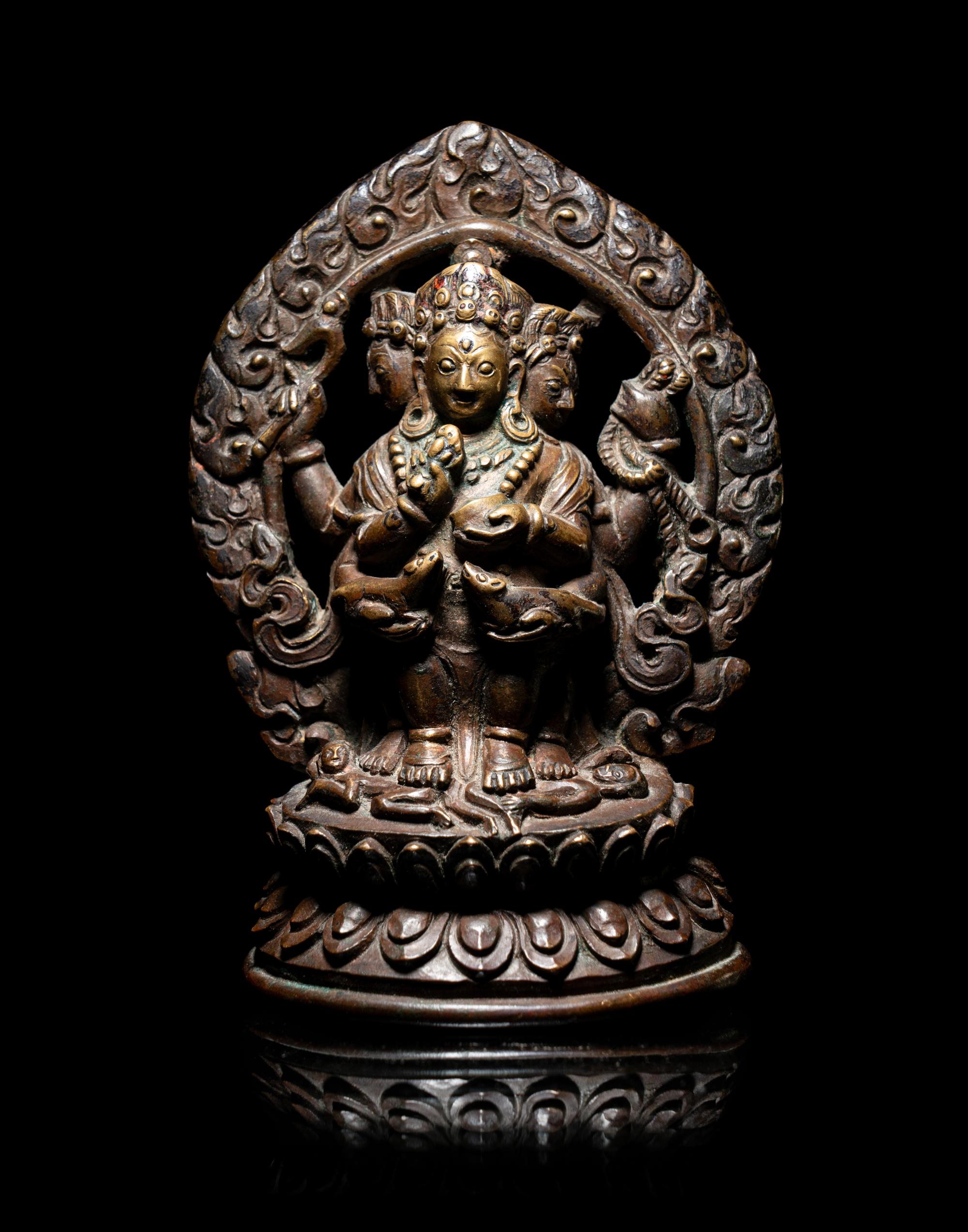 A Rare Tibetan Bronze Figure of Red Jambhala