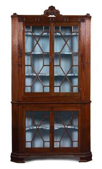 A Regency Carved Mahogany Corner Cabinet Height 87 1/2 x width 44 x depth 24 inches. — 19TH CENTURY