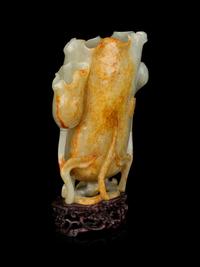 A Russet and Celadon Jade Lotus Cup