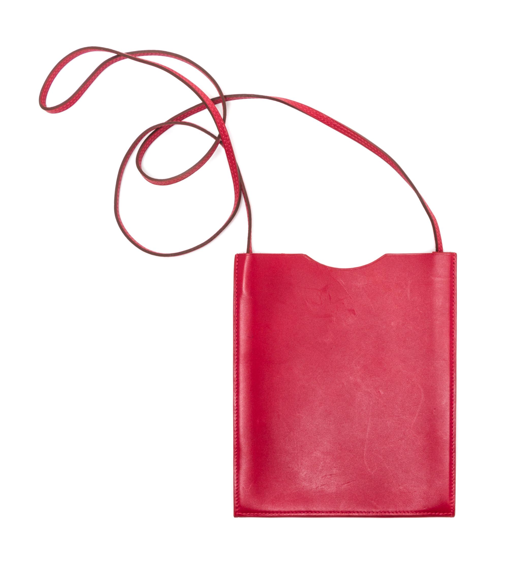 An Hermes Rouge Leather Passport Pouch, 7" x 8" x 1".