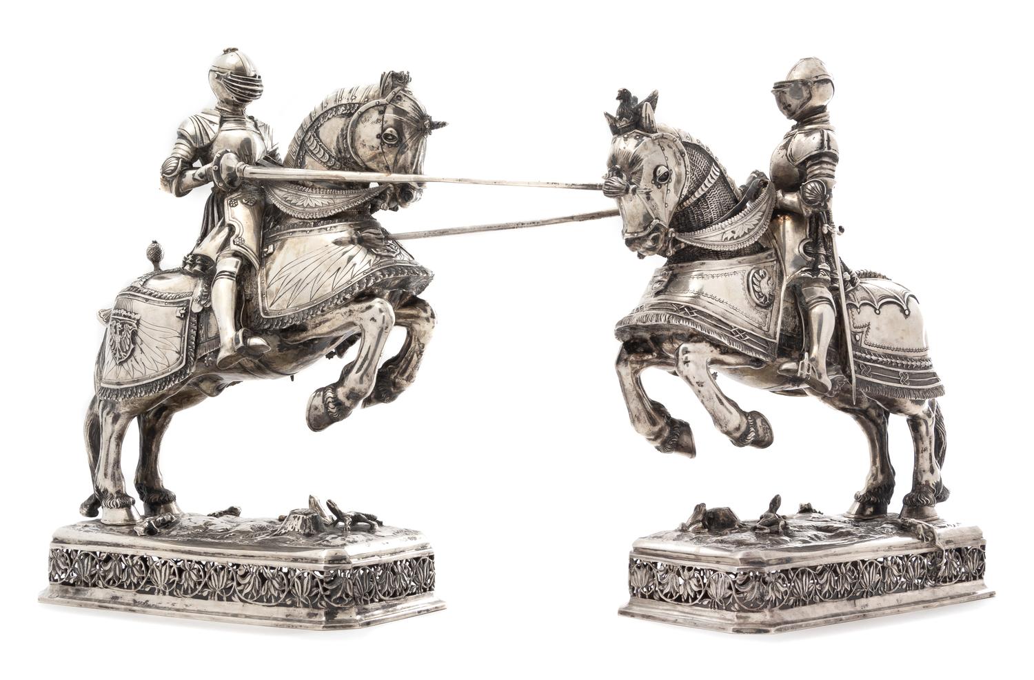 A Pair of German Silver Equestrian Groups, Ludwig Neresheimer, Hanau, Late 19th/Early 20th Century, each in the form of a charging knig