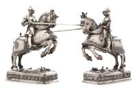A Pair of German Silver Equestrian Groups, Ludwig Neresheimer, Hanau, Late 19th/Early 20th Century, each in the form of a charging knig