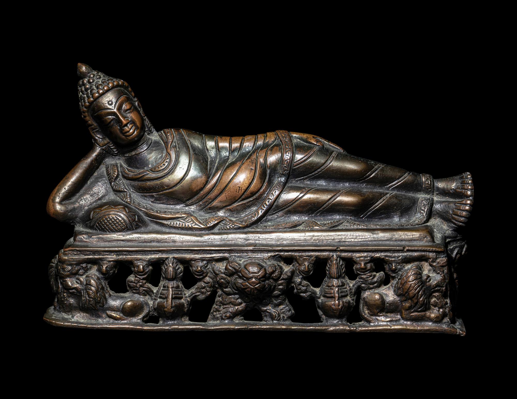 A Tibetan Bronze Figure of a Reclining Buddha