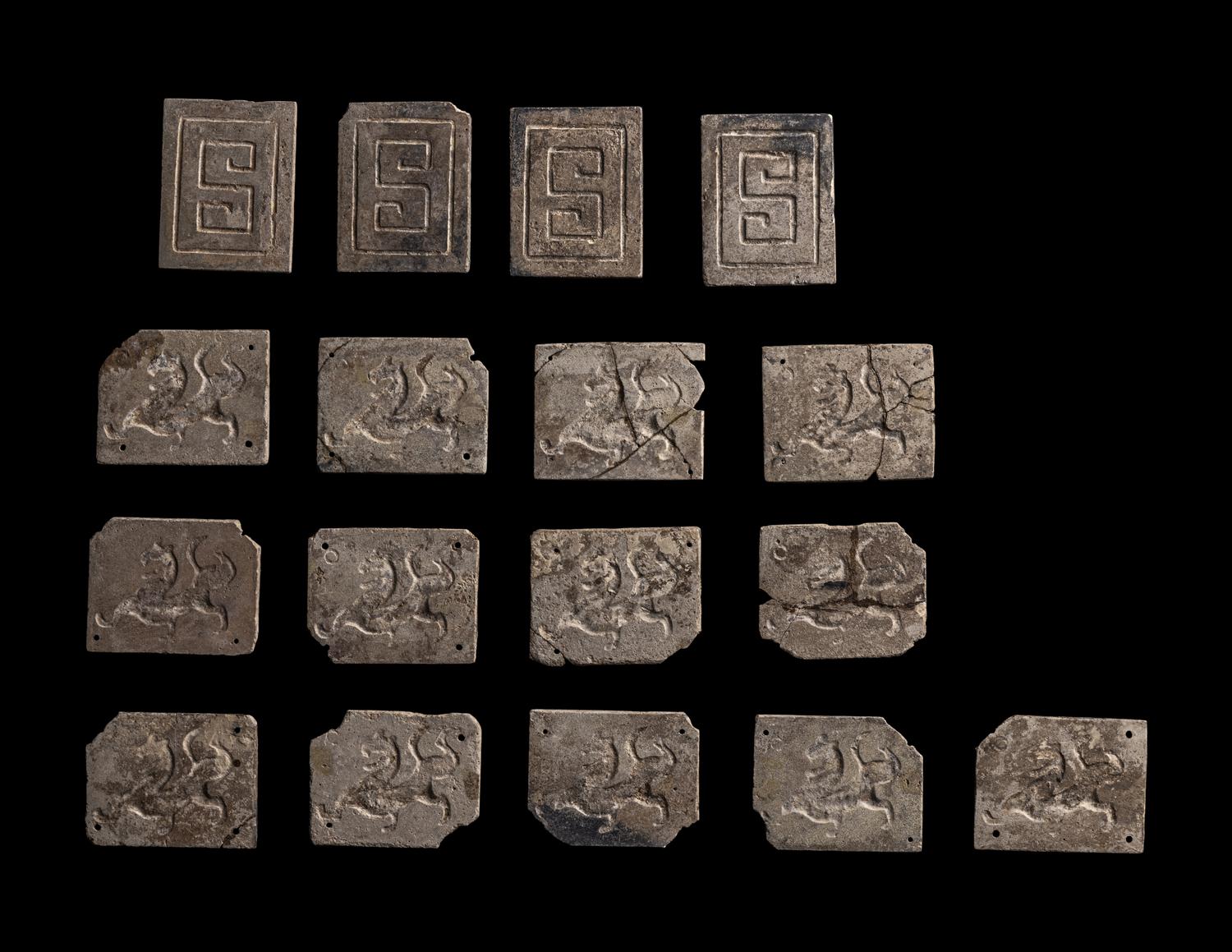 A Set of 17 Chinese Calcified Jade Plaques