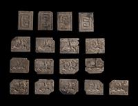 A Set of 17 Chinese Calcified Jade Plaques