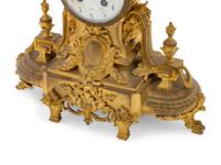 A French Gilt Bronze Figural Mantel Clock