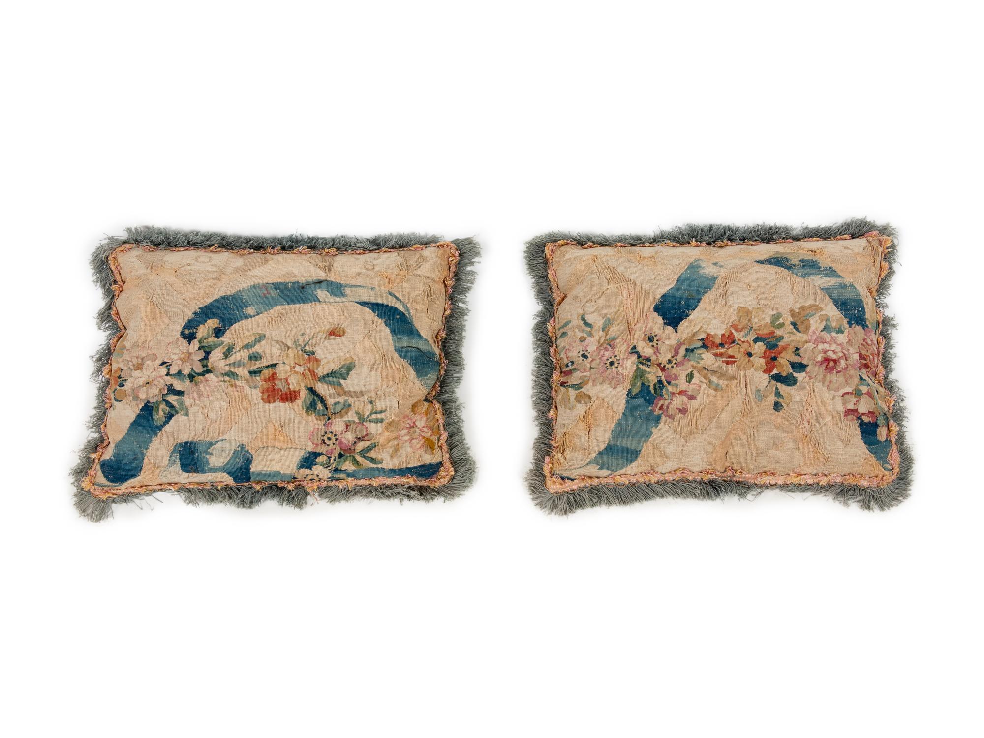 A Collection of Six Needlepoint and Tapestry Upholstered Cushions