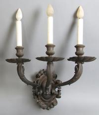 A Set of Four Neoclassical Three-Light Sconces, Caldwell, Height 15 1/2 inches.