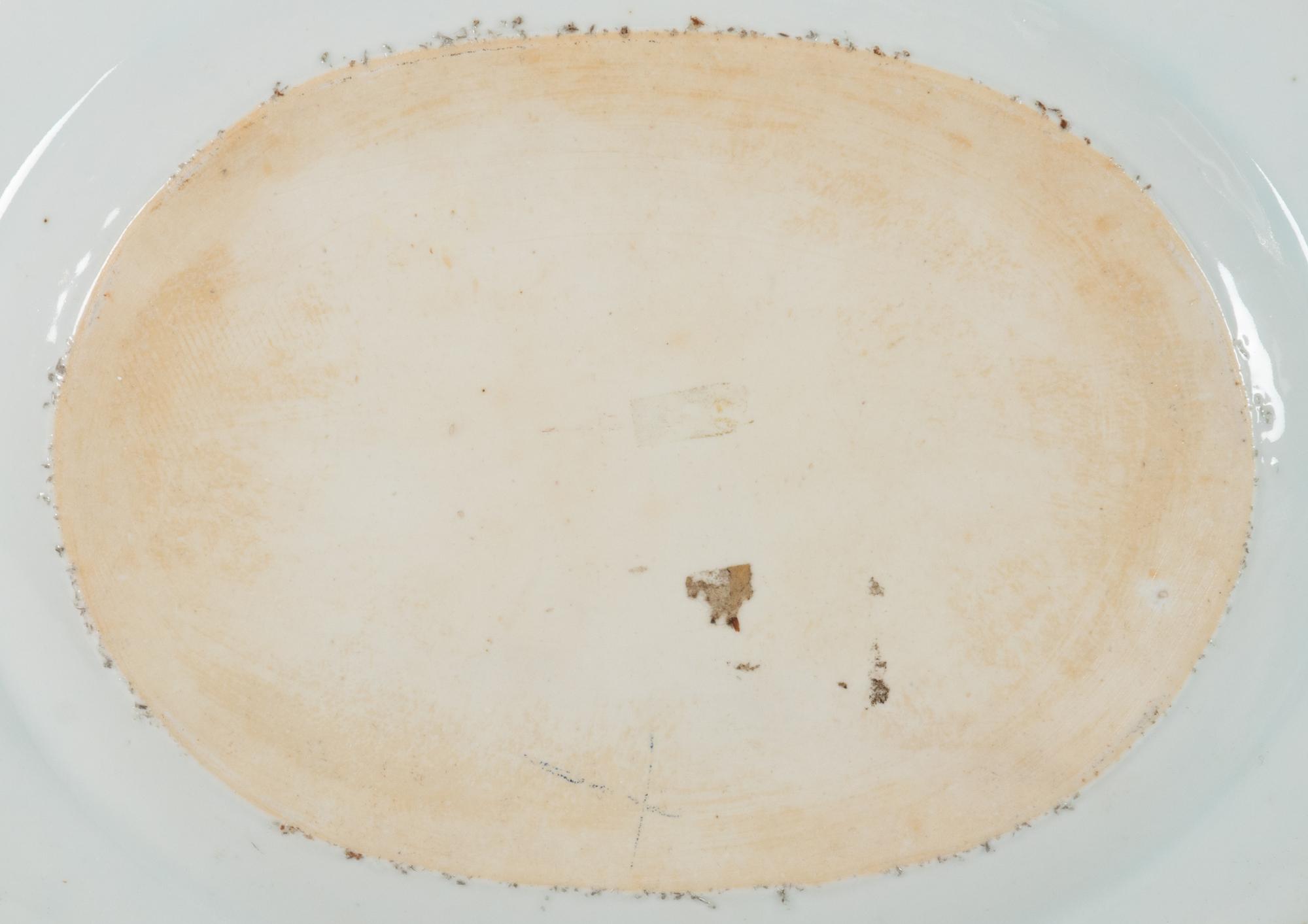 A Pair of Chinese Export Porcelain Armorial Platters Raised on Later Mahogany Stands