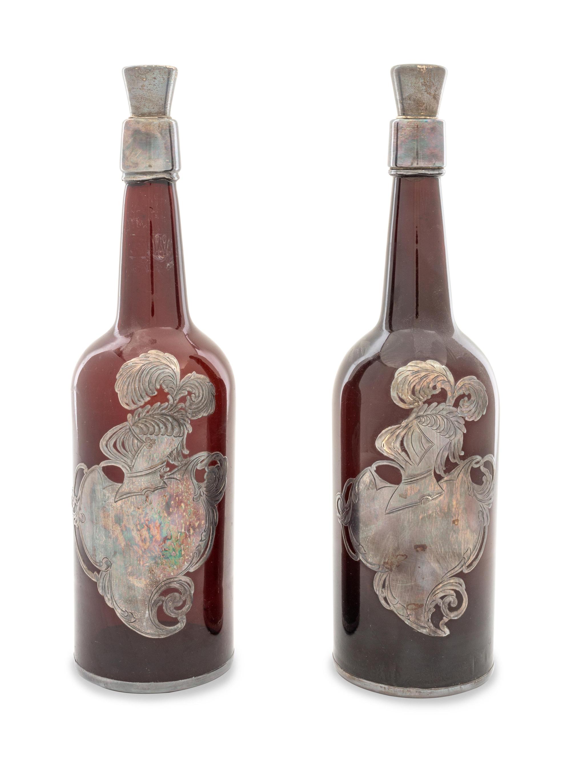 A Pair of Silver Overlay Whiskey Bottles