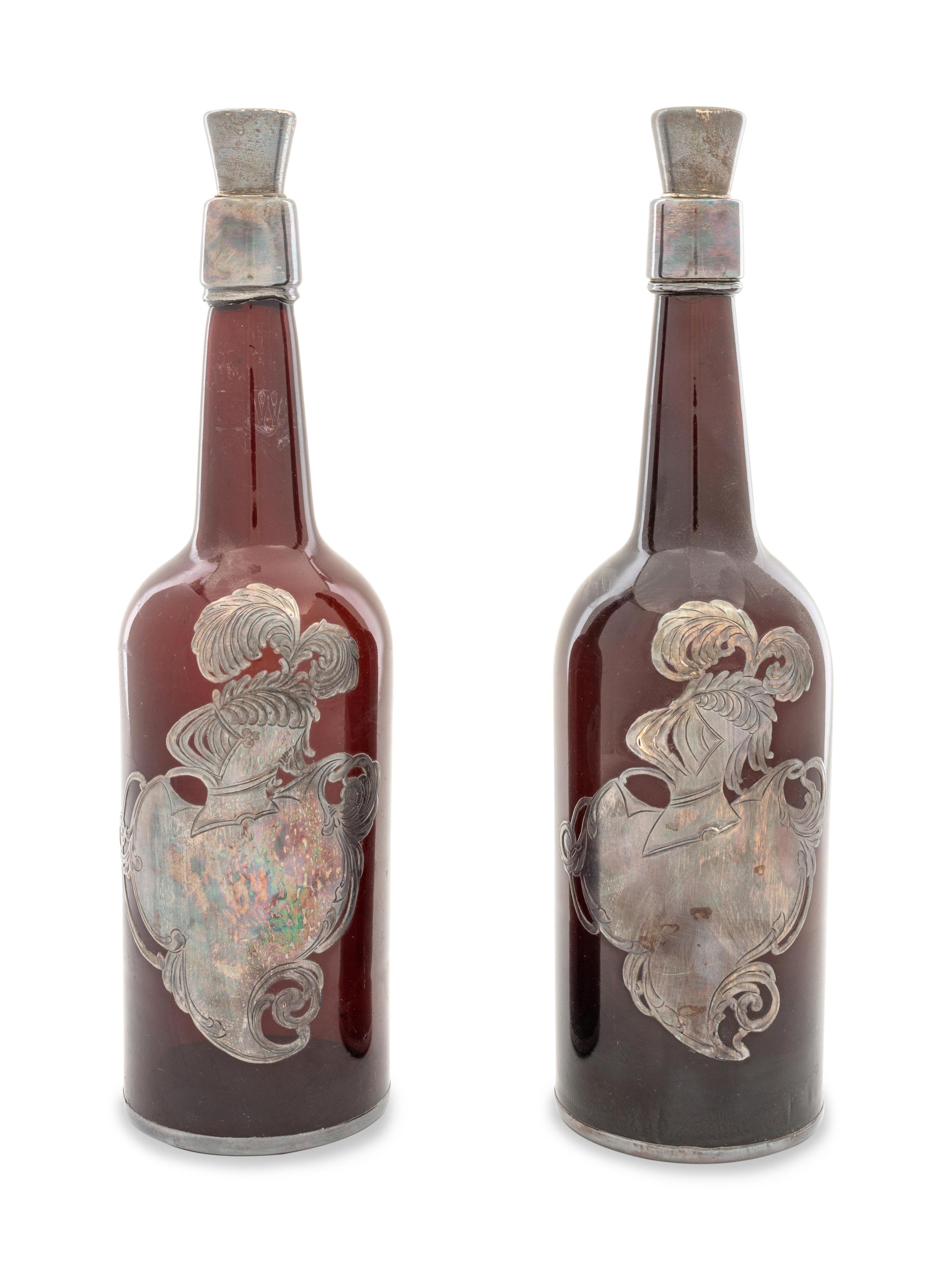 A Pair of Silver Overlay Whiskey Bottles