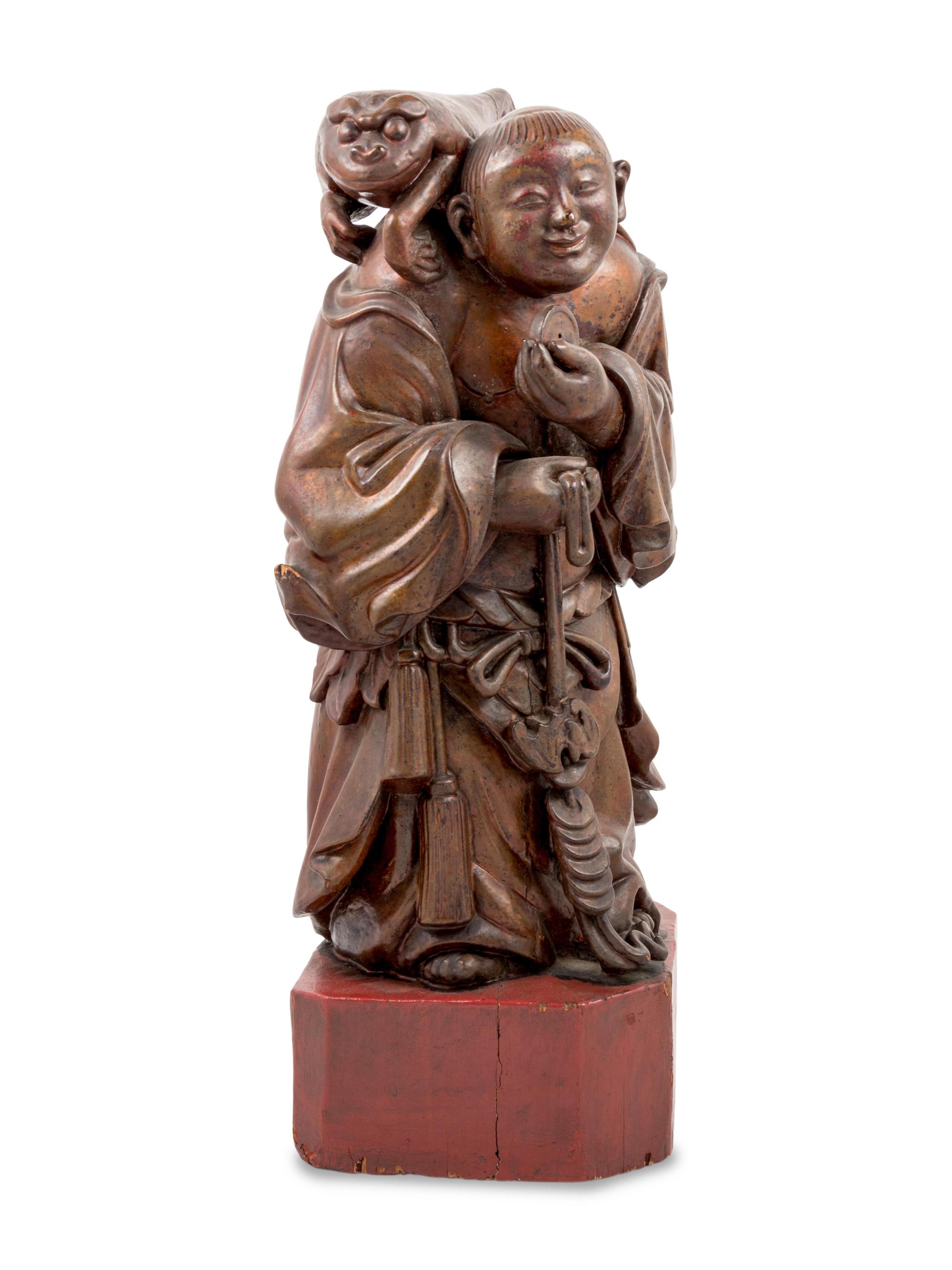 A Chinese Gilt Lacquered Wood Figure of Immortal Liu Hai