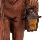 A Black Forest Carved Walnut 'Night Watchman' Lamp