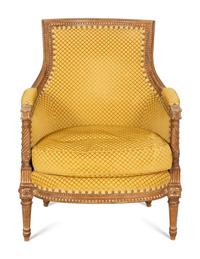 A Louis XVI Style Carved Beech Bergère