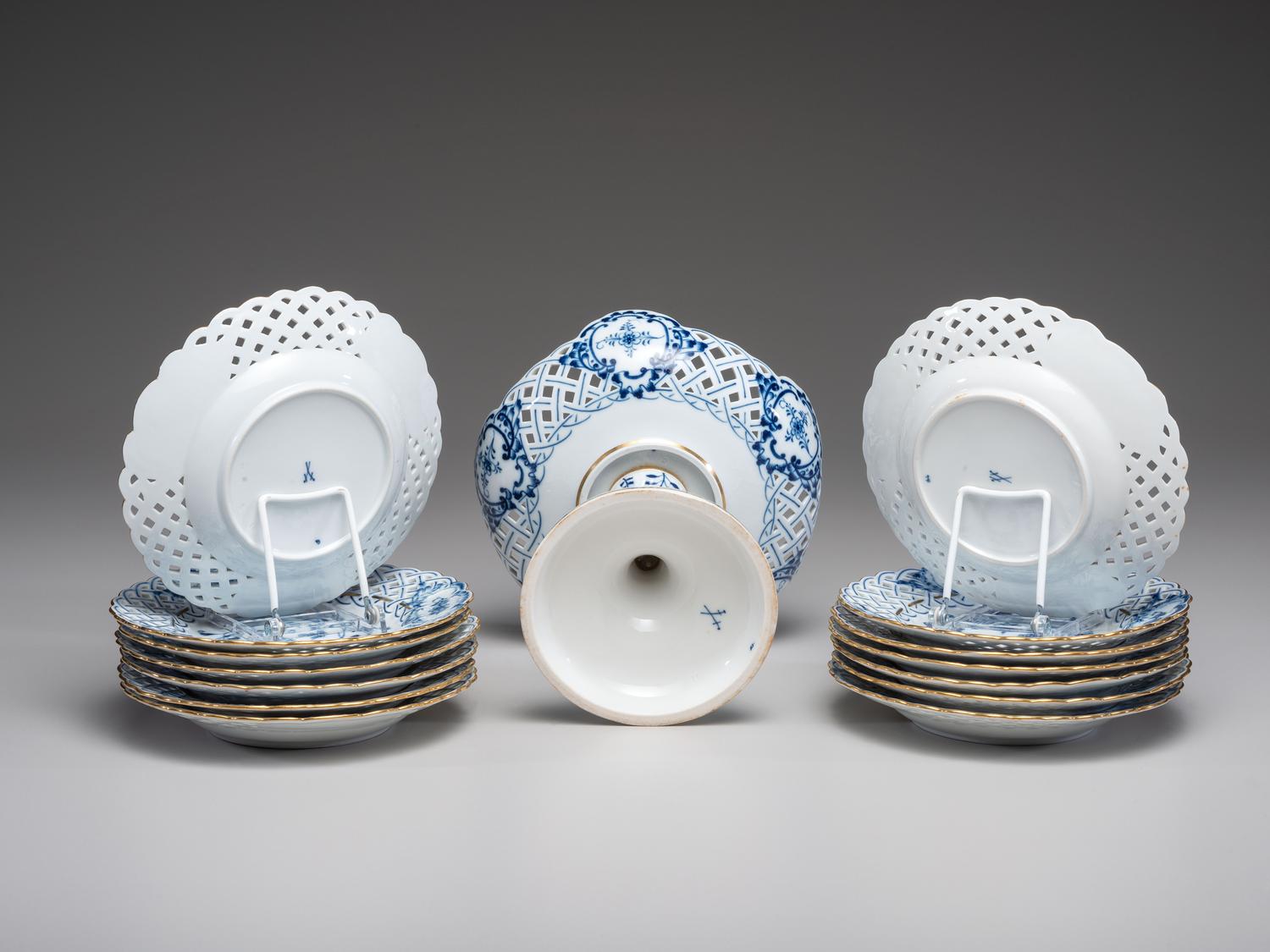 Fourteen Meissen ' Blue Onion' Reticulated Porcelain Plates
