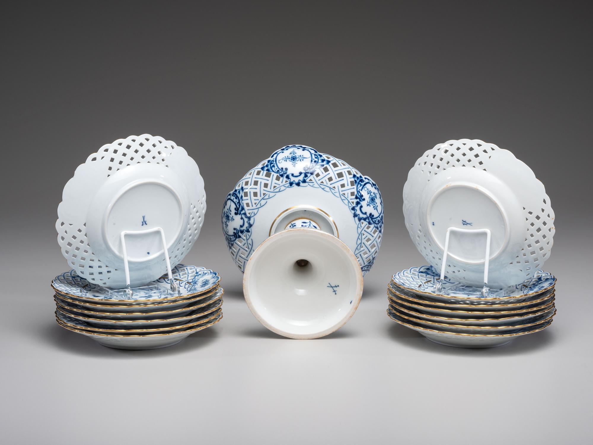 Fourteen Meissen ' Blue Onion' Reticulated Porcelain Plates