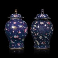 A Pair of Chinese Enameled Blue-Ground Porcelain Jars and Covers, First Half 19th Century — 清中期 藍地粉彩蝶戀花紋將軍罐一對