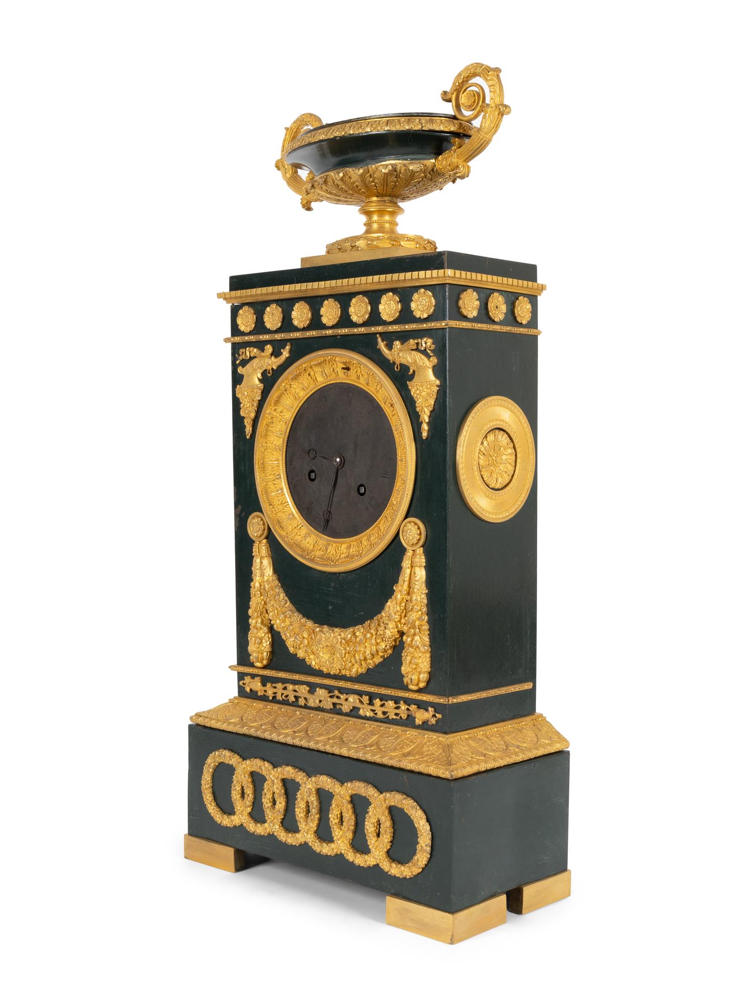 An Empire Gilt Bronze and Tôle Peinte Mantel Clock