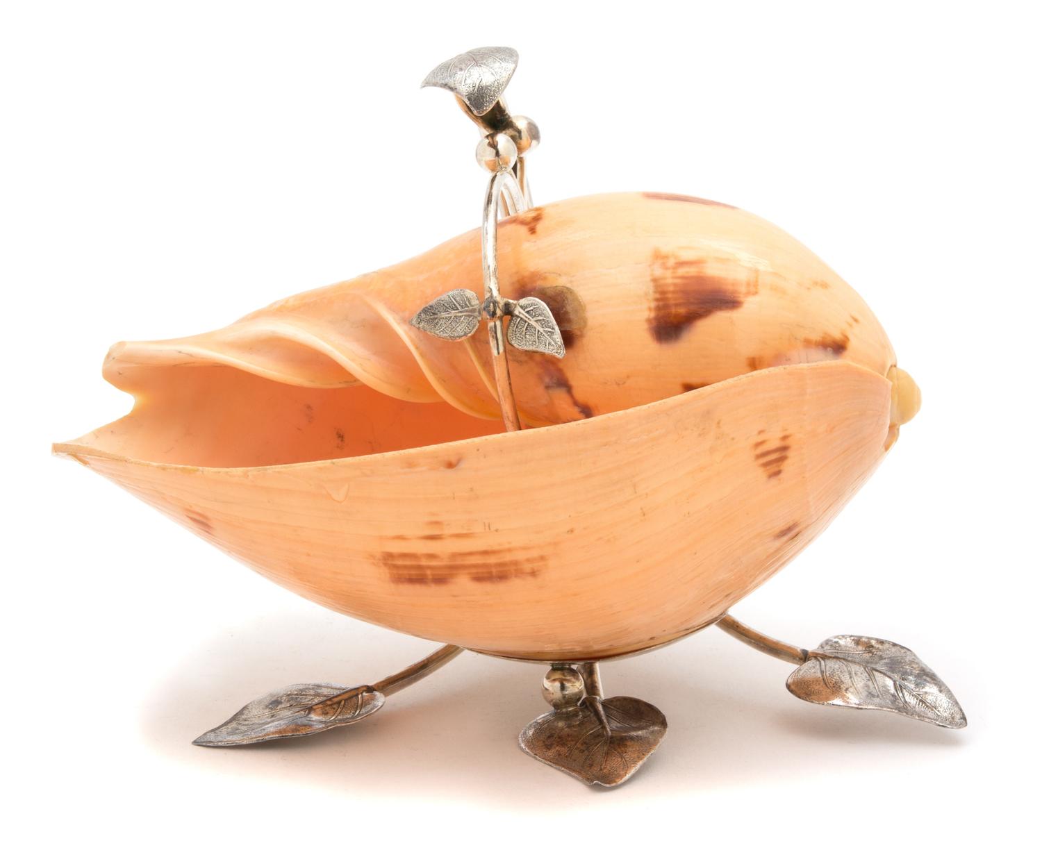 A Peruvian Camusso Silver Foliate-Form Stand, 20TH CENTURY, holding a melon shell