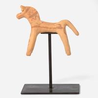 A Boeotian terracotta figure of a horse circa 6th century B.C.