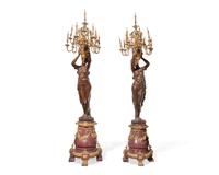An impressive pair of large French gilt-bronze mounted bronze and rouge marble torchères, 20th century