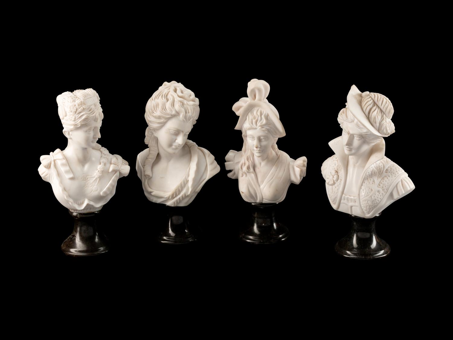 A Set of Four Italian Marble Busts of Women