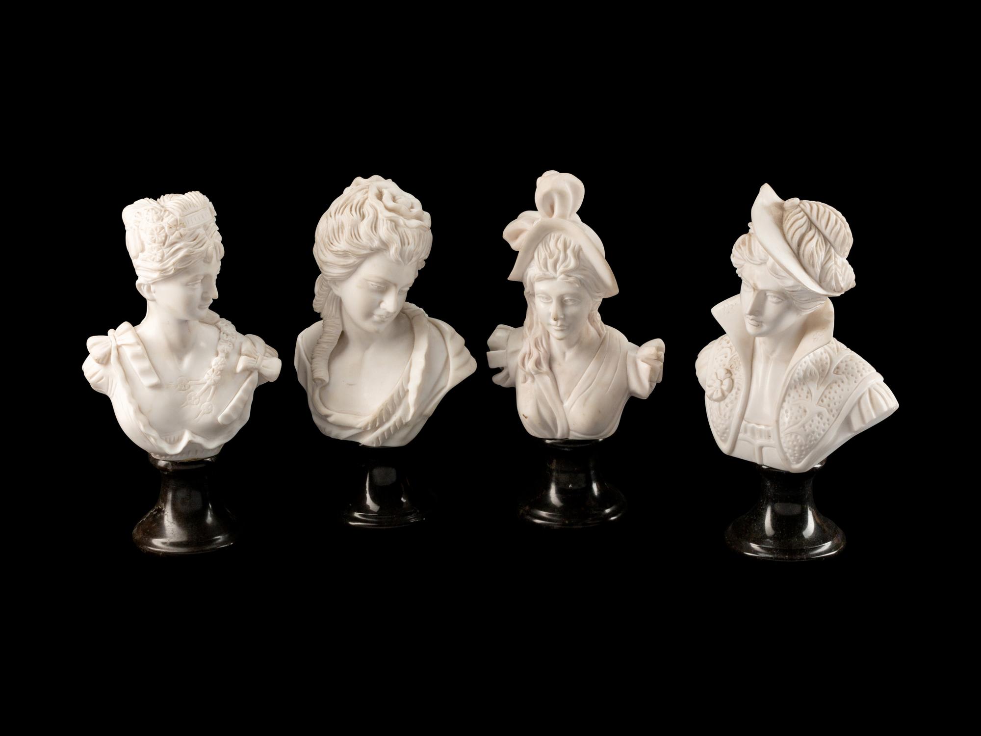 A Set of Four Italian Marble Busts of Women