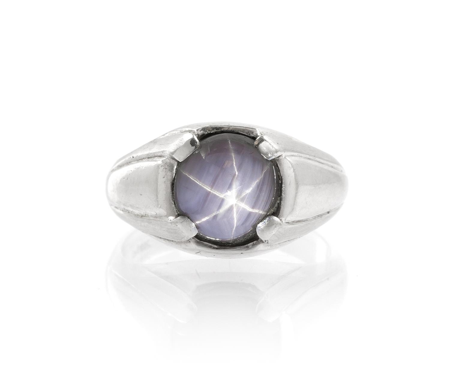 A 14 Karat White Gold and Star Sapphire Ring, 5.40 dwts.