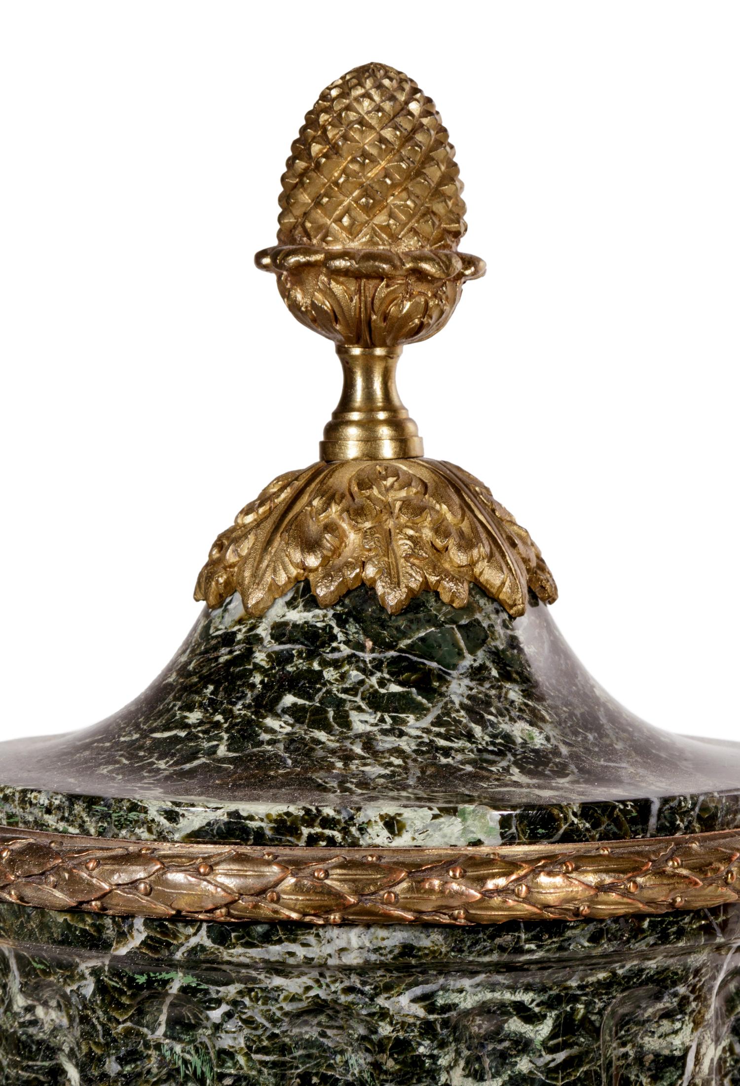 A Pair of Louis XVI Style Gilt Bronze and Marble Urns