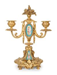 A French Gilt Bronze and Sèvres Porcelain Clock Garniture
