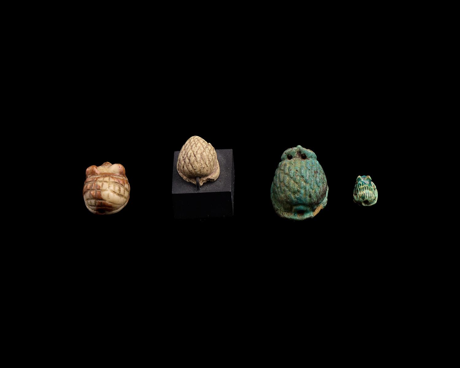Four Egyptian Faience and Jasper Hedgehog Scaraboids