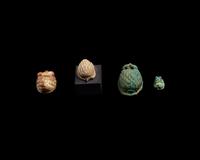 Four Egyptian Faience and Jasper Hedgehog Scaraboids