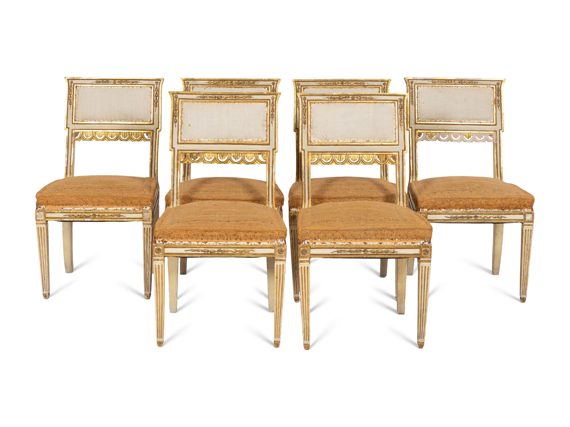 An Italian Louis XVI Style Cream Painted and Parcel Gilt Parlor Suite